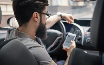 man-using-mobile-phone-while-driving_158595-4198